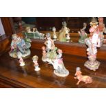 A collection of five Capodimonte figurines; together with a model of a dog;