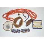 A branch coral necklace; an otter paw brooch; an enamel belt buckle; and sundries.