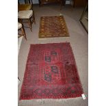 A Turkoman style rug with teke field; together with another Turkoman type rug,