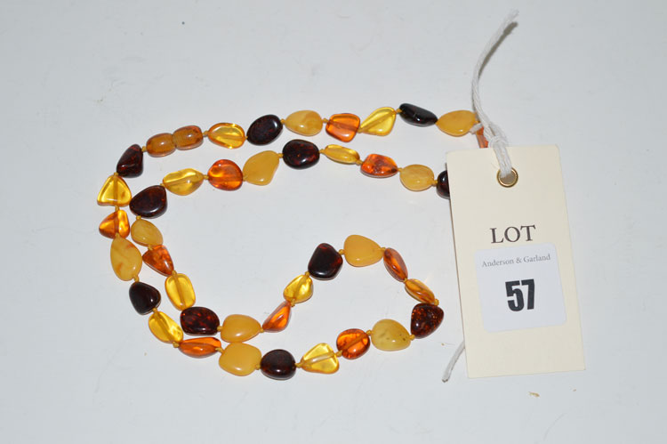 An amber necklace, of red, orange, translucent and opaque amber.