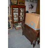 An Edwardian inlaid display cabinet; together with a dark stained oak drop leaf table.