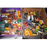 Two boxes of toy vehicles, including: a Batmobile with Batman and Robin.