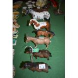 A collection of seven Beswick horses, ponies and a donkey, comprising: a pair of model no.