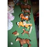 A collection of Beswick ware ornaments, mainly horses, comprising: a brown mare; five foals,