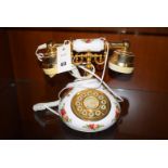 A Royal Albert 'Old Country Rose' pattern telephone with brass fittings.