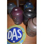 Five decorated coffee tins; and an enamel sign.