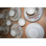 A Chinese porcelain part afternoon tea set, decorated exotic flowers and foliage,