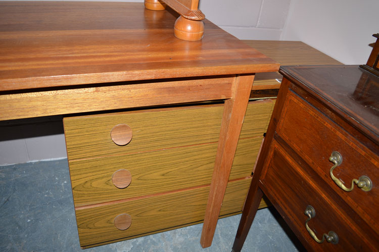 A walnut veneered chest of six short drawers.