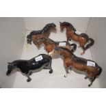 Five Beswick horses and ponies, various (two with damaged ears).