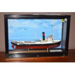 A model ship in a case, the MV Seaman,