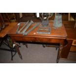 A 19th Century mahogany turnover top tea table, raised on turned legs.