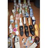 A collection of decorative ceramic shoes.