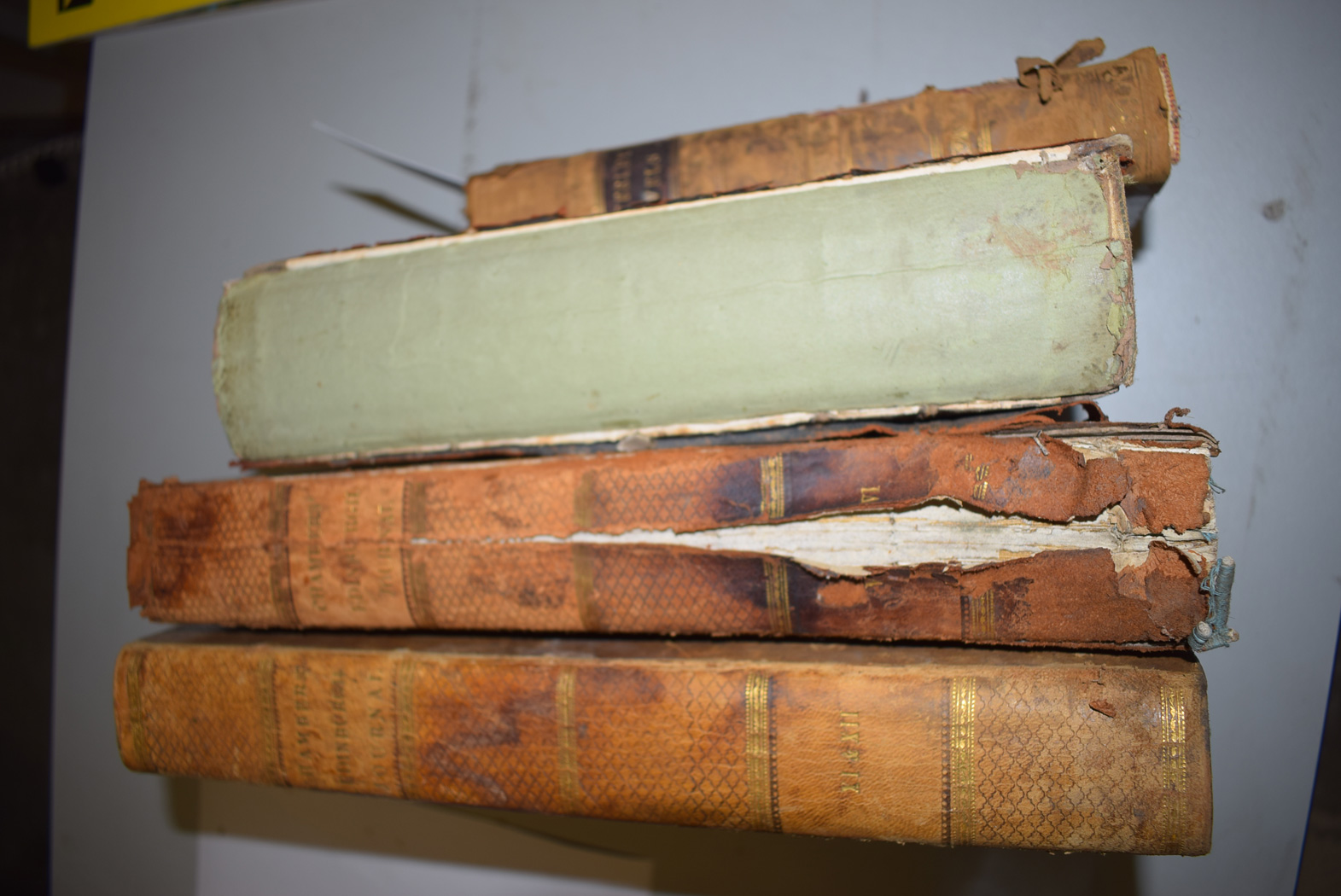 Four distressed 19th century leather bound volumes comprising; single volume Waverley Novel,