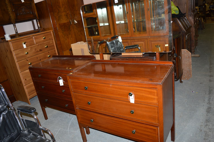 An early 20th Century mahogany chest of three long drawers; together with a matching dressing table.