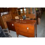 An early 20th Century mahogany chest of three long drawers; together with a matching dressing table.