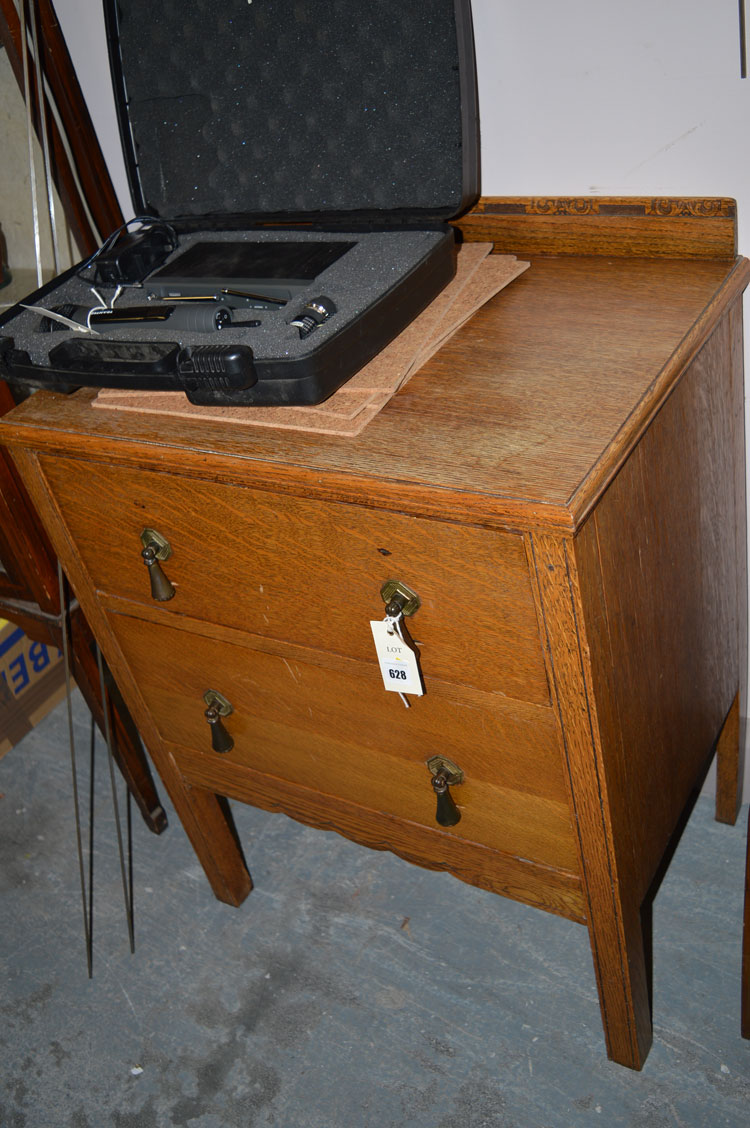 An oak chest of two drawers.