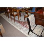 A Chinese carpet, the central oval medallion and surround with leaf design on ivory ground.