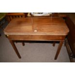 A 19th Century mahogany turnover top tea table, raised on square legs.