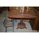 A 19th Century mahogany turnover top table;