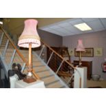 A pair of early 20th Century oak table lamps, carved with egg beading and reeded design.