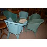 A collection of four blue painted Lloyd loom chairs and a basket chair;