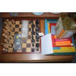 A wooden chess set and board; two sets of dominoes; an Etch-a-Sketch in original box;