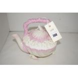 A Belleek shell-shaped teapot with clam shell lid and shell finial,