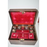 A 19th Century rosewood work box, with mother-of-pearl cartouche to cover,