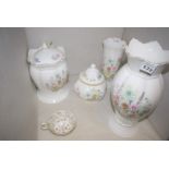 Two Aynsley 'Wild Tudor' pattern vases; two jars and covers;