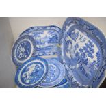 Three 19th Century blue and white meat plates, two 'Willow' pattern, one with landscape pattern.