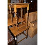 Two oak occasional tables, raised on barley twist legs.