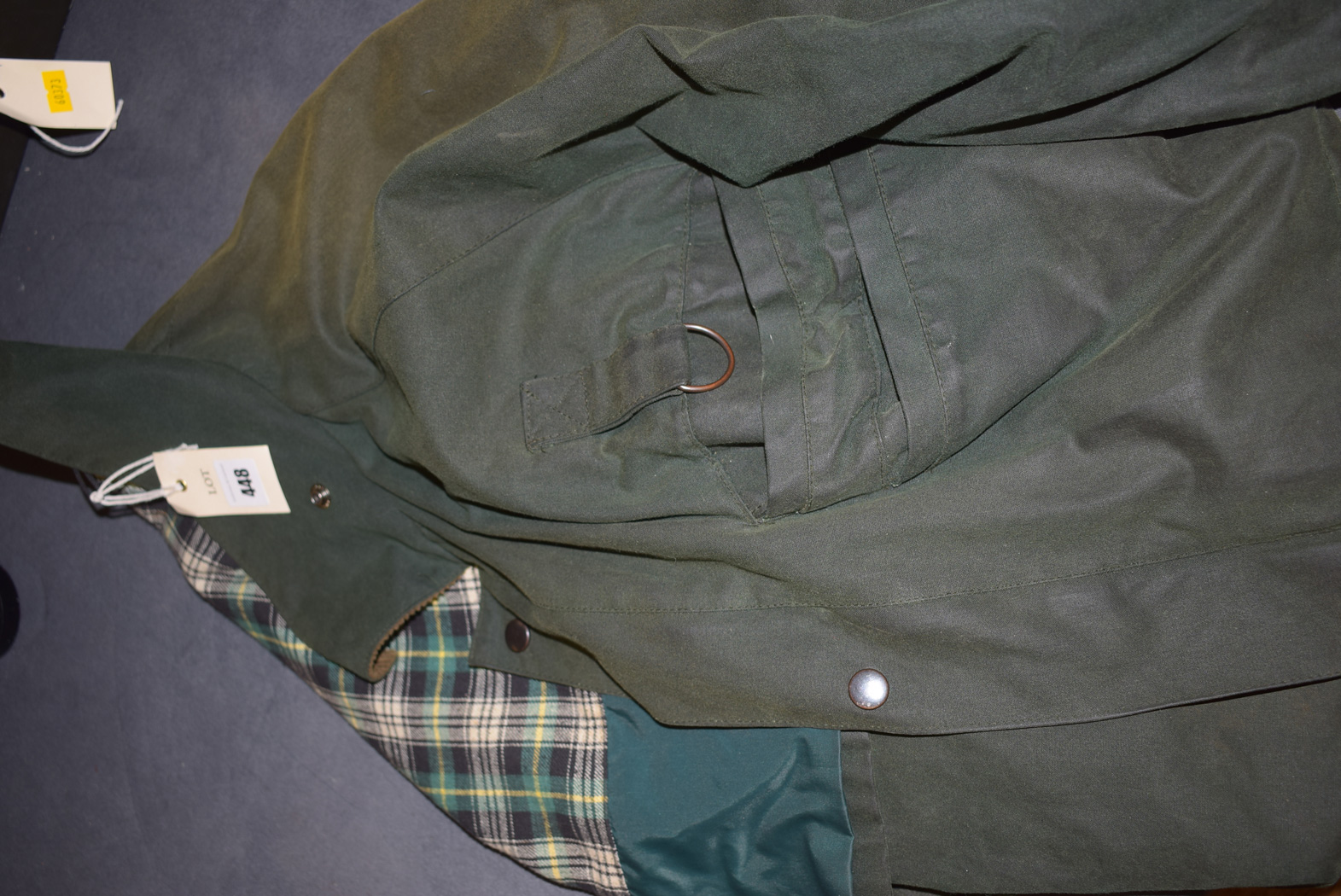 A fisherman's waxed cotton wading jacket with corduroy collar.