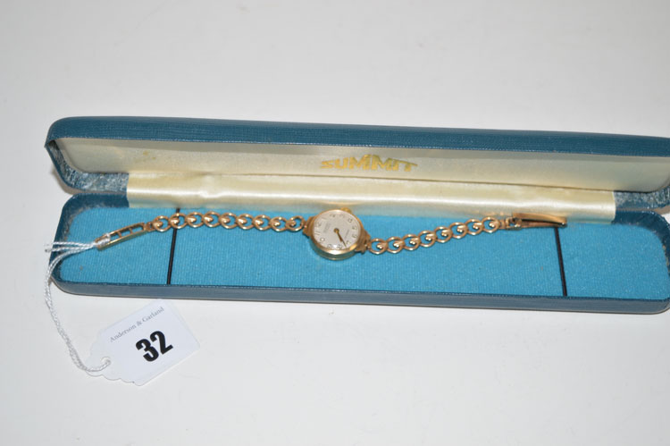 A 9ct. yellow gold cased ladies cocktail watch by Summit, on 9ct.