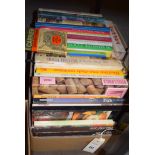 A box of cookery books.