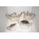 A four-piece Britannia metal Victorian tea service, comprising: teapot, hot water jug,