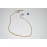A cultured pearl graduated single row necklace; together with a 9ct.