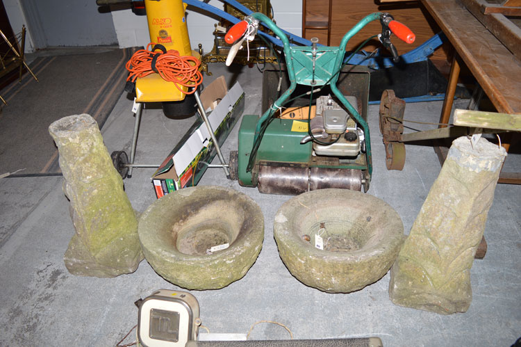 Two stone bird baths, the circular tops on tapering supports.