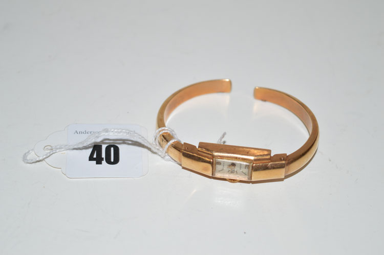An 18ct. yellow gold cased bangle watch by Sigma, 11.9grms gross.