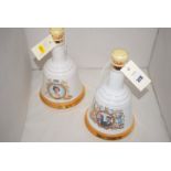 Two Wade hand bell-shaped ware whisky decanters,