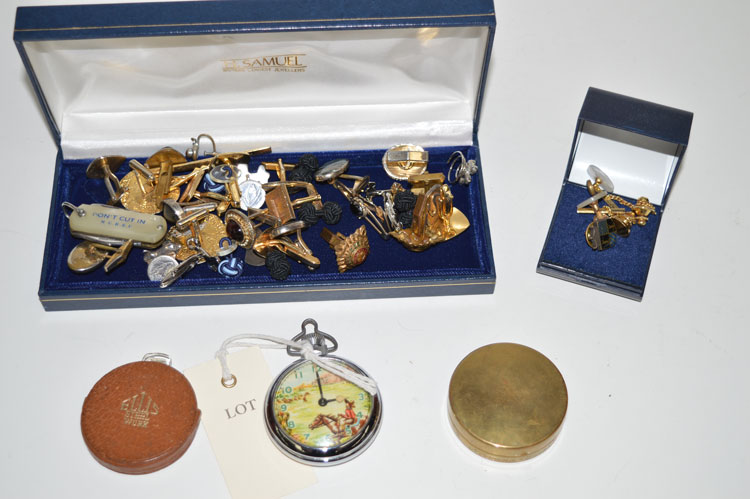 An Empire toy pocket watch with moving rider on horseback;