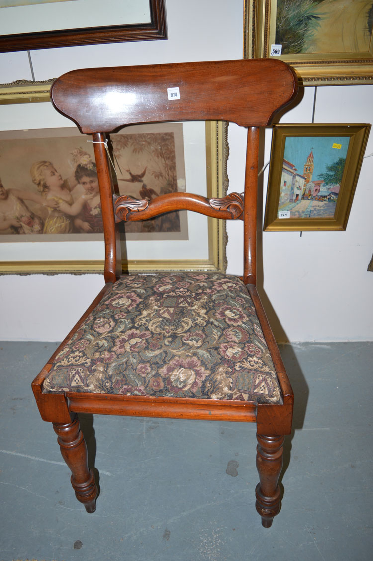A set of six mid-19th Century mahogany dining chairs with drop-in seats and splat backs,