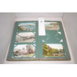 A vintage postcard album of local scenes.