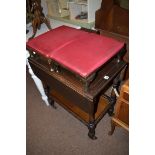 An oak drop leaf trolley with undertier; together with two footstools.