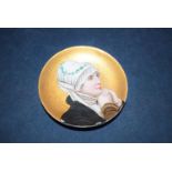 A Continental porcelain dish decorated with a portrait of a young lady.