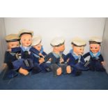 A collection of six Nora Wellings 'Sailor Boy' dolls with ship's names on their caps,