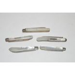 Five mother-of-pearl mounted folding fruit knives, three with silver blades.