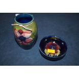A small Moorcroft vase with floral decoration;