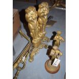 A pair of gilt spelter figures; brass fire irons; and a pair brass lion andirons.