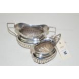 A silver two-handled sugar bowl and matching cream jug, of half fluted form, by J.W.