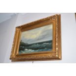 An oil painting - stormy coastal scene, indistinctly signed, in gold painted frame.